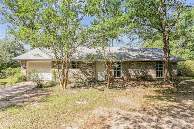 5471 Shamrock St, Milton, FL 32570 - single story home with an attached garage, driveway, and brick siding