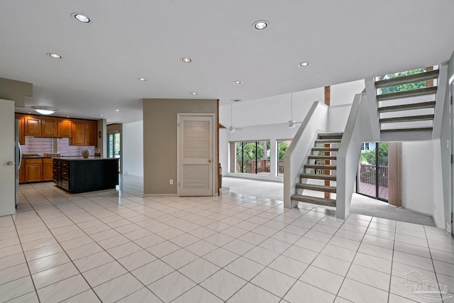1567 Whisper Bay Blvd, Gulf Breeze, FL 32563 - unfurnished living room with stairway, recessed lighting, light tile patterned flooring, and a ceiling fan