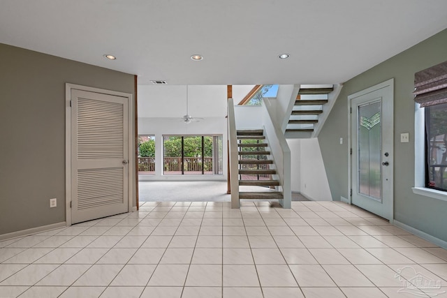 1567 Whisper Bay Blvd, Gulf Breeze, FL 32563 - staircase with recessed lighting, baseboards, a ceiling fan, tile patterned floors, and carpet