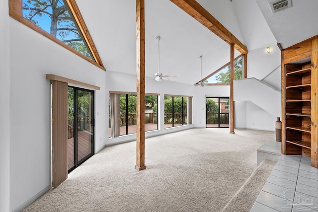 1567 Whisper Bay Blvd, Gulf Breeze, FL 32563 - unfurnished living room featuring high vaulted ceiling, light carpet, beamed ceiling, a ceiling fan, and stairs