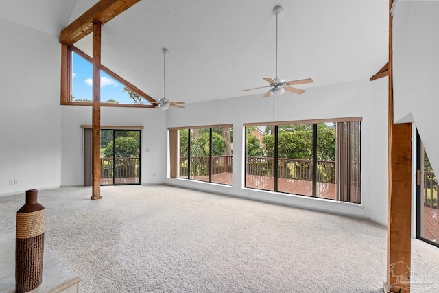 1567 Whisper Bay Blvd, Gulf Breeze, FL 32563 - unfurnished living room featuring high vaulted ceiling, ceiling fan, carpet, beam ceiling, and baseboards