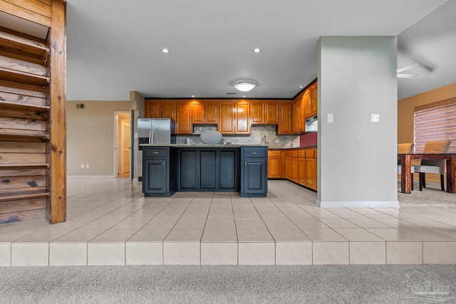 1567 Whisper Bay Blvd, Gulf Breeze, FL 32563 - kitchen with light tile patterned flooring, a kitchen island, stainless steel fridge with ice dispenser, baseboards, and recessed lighting