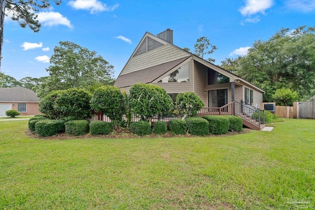 1567 Whisper Bay Blvd, Gulf Breeze, FL 32563 - view of side of home with a deck, a chimney, and central AC unit