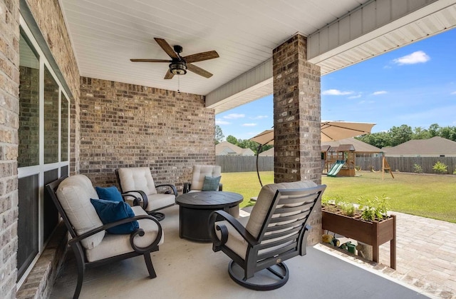 view of patio with a fenced backyard, ceiling fan, a playground, and a fire pit