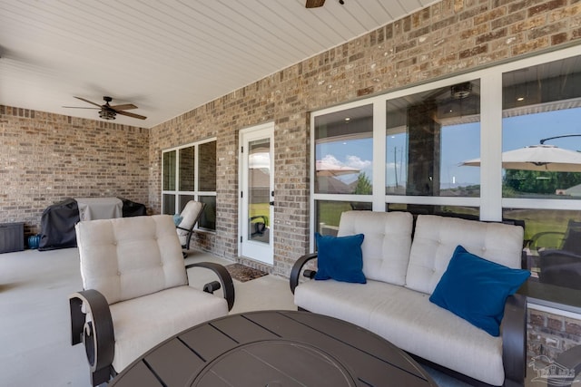 view of patio featuring area for grilling, ceiling fan, and an outdoor hangout area