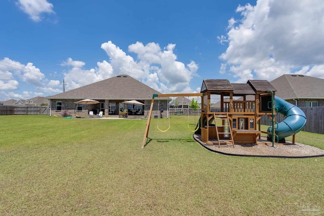 view of play area featuring fence and a yard