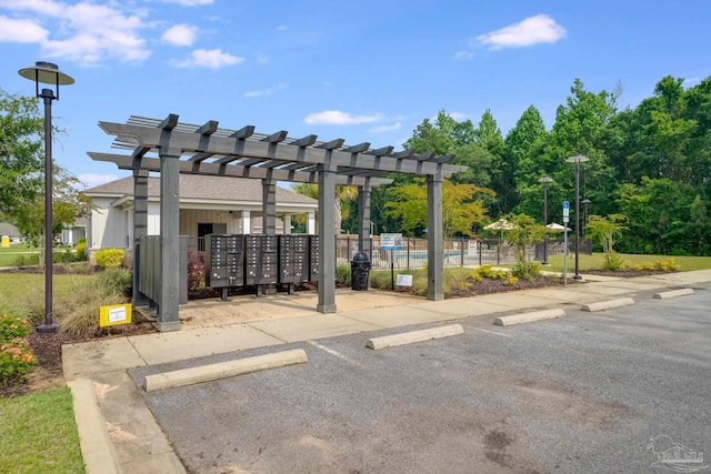 3921 Amble Way, Pace, FL 32571 - uncovered parking lot with mail area and fence