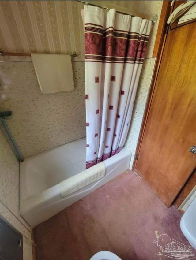 full bath with a shower with shower curtain and a bathtub