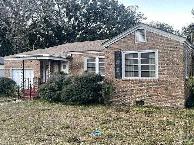 single story home with brick siding and crawl space