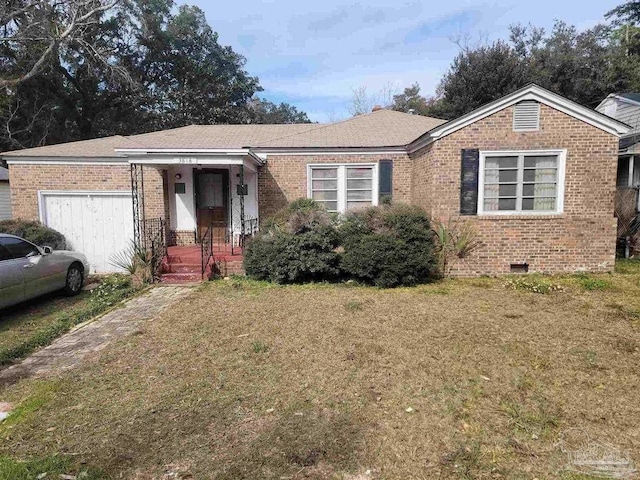 view of front of house with a front lawn, brick siding, and crawl space