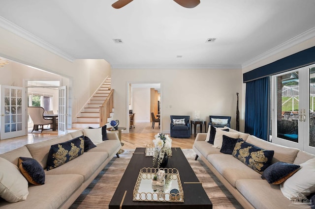 living room featuring ceiling fan, crown molding, and french doors