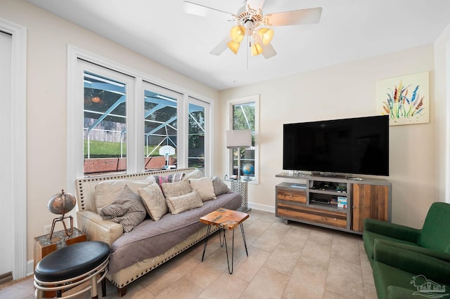 tiled living room featuring ceiling fan