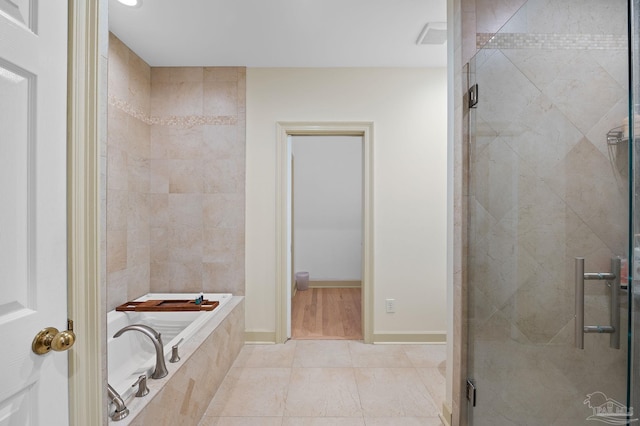 bathroom featuring plus walk in shower and tile patterned flooring