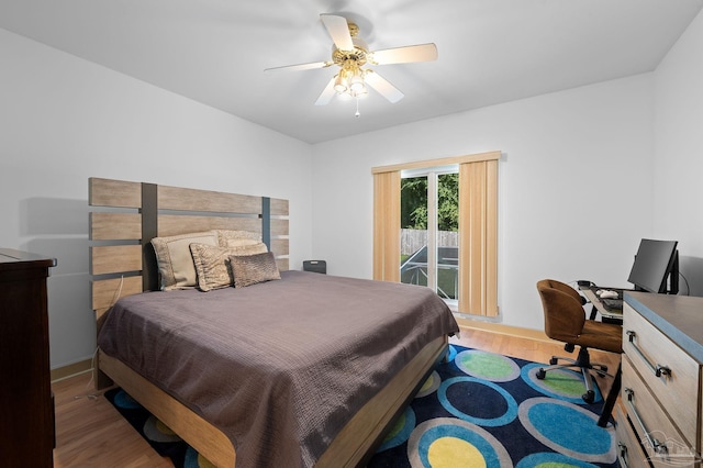 bedroom featuring ceiling fan, hardwood / wood-style floors, and access to outside