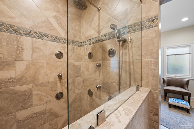 bathroom with a tile shower