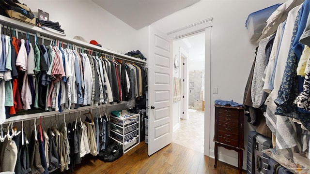 spacious closet featuring hardwood / wood-style floors