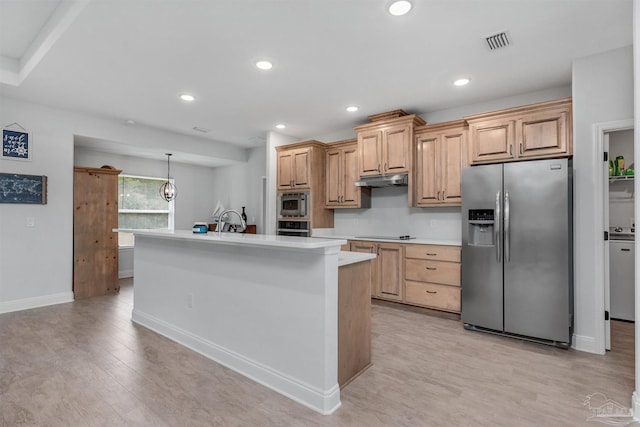 kitchen with light brown cabinets, light hardwood / wood-style floors, stainless steel appliances, and a kitchen island with sink