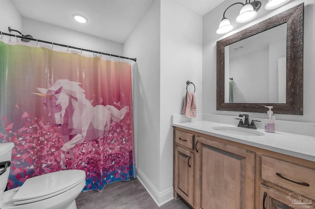 bathroom with a shower with shower curtain, wood-type flooring, vanity, and toilet