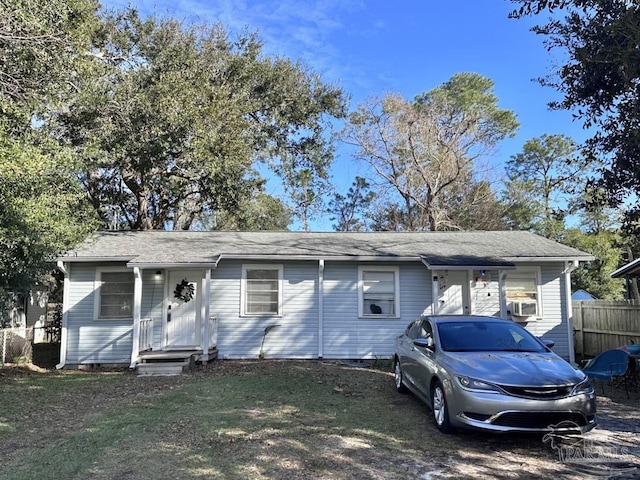 view of front of property featuring fence