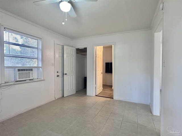 unfurnished bedroom featuring baseboards, ensuite bath, ceiling fan, cooling unit, and crown molding