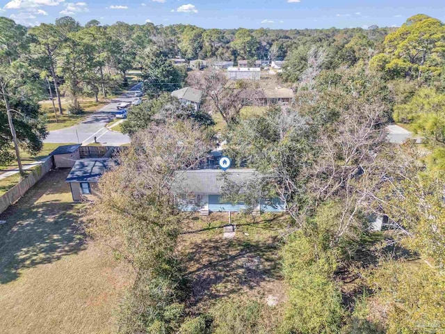 bird's eye view featuring a wooded view