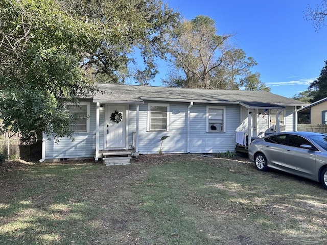 view of front of property with entry steps and a front yard