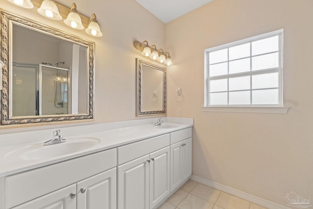 bathroom with vanity, tile patterned floors, and walk in shower