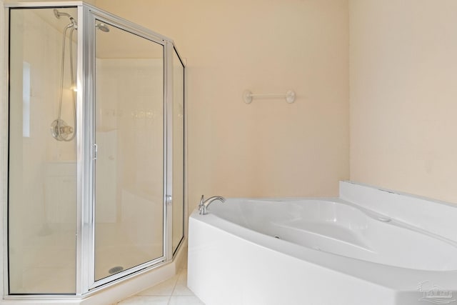 bathroom featuring tile patterned flooring and independent shower and bath