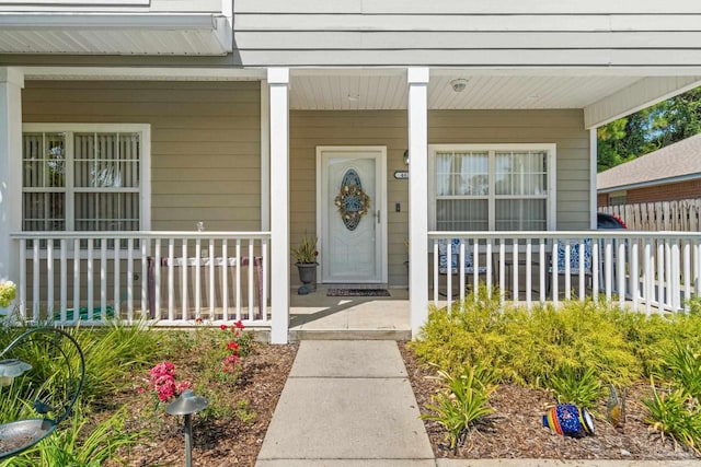 doorway to property featuring a porch