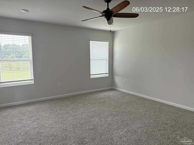 8659 Tarsus Dr, Milton, FL 32583 - spare room featuring a ceiling fan, a textured ceiling, plenty of natural light, carpet flooring, and baseboards