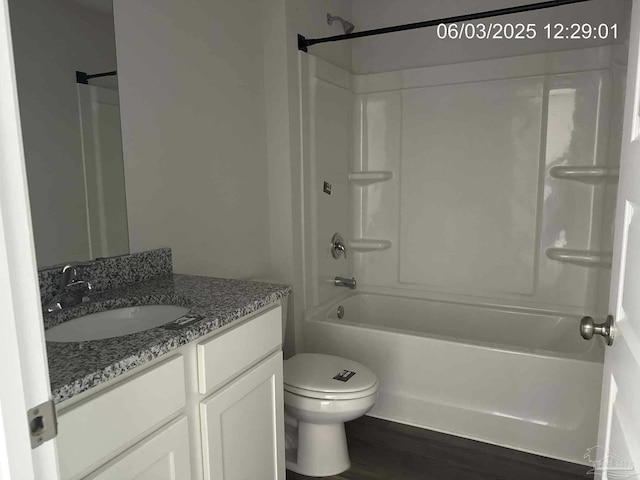 8659 Tarsus Dr, Milton, FL 32583 - bathroom featuring vanity, shower / bath combination, toilet, and wood finished floors