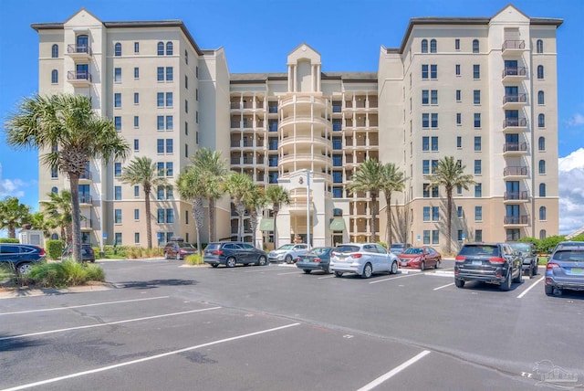 view of property featuring uncovered parking