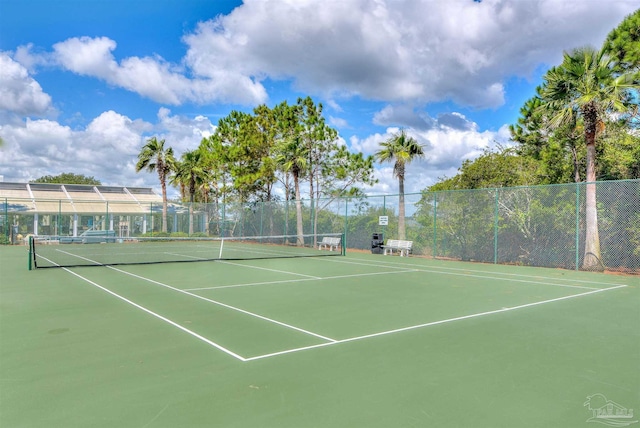 view of sport court with fence