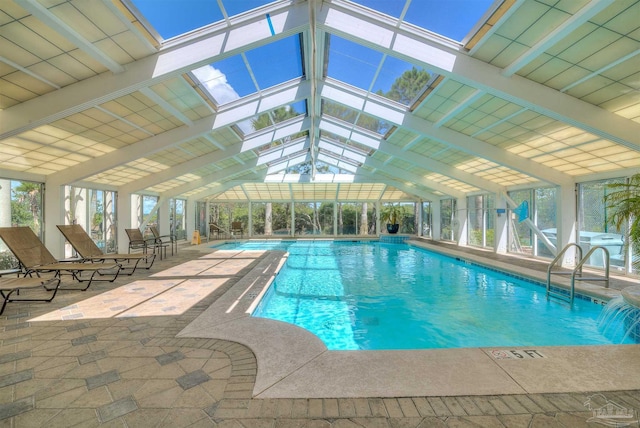 pool featuring a lanai and a patio area