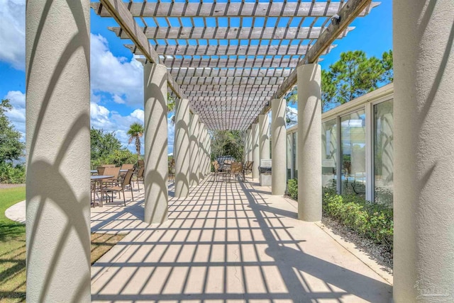 view of patio / terrace featuring outdoor dining area and a pergola