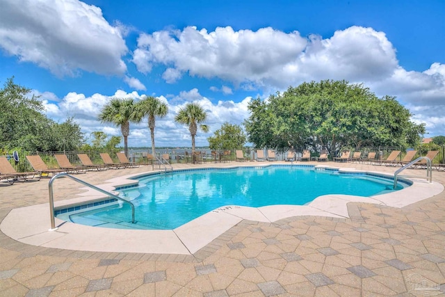 pool featuring a patio and fence