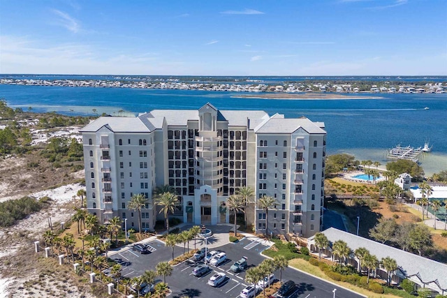 birds eye view of property with a water view