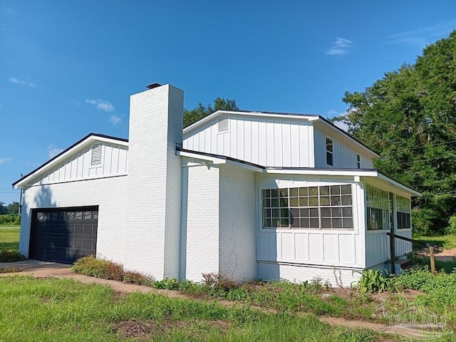 view of side of property with a garage