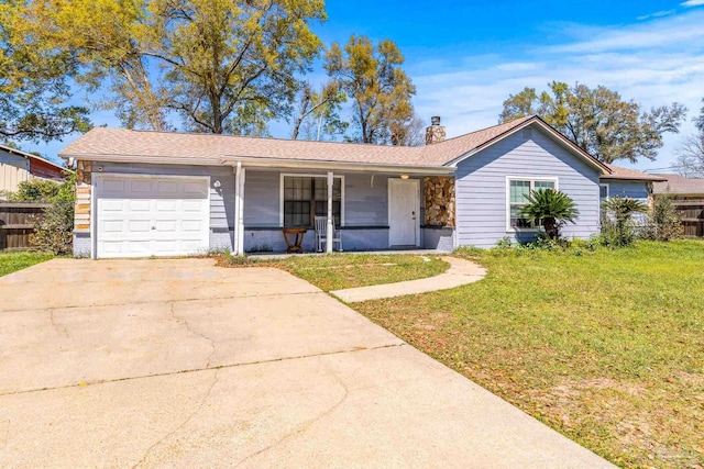 ranch-style house featuring a front lawn, covered porch, and a garage