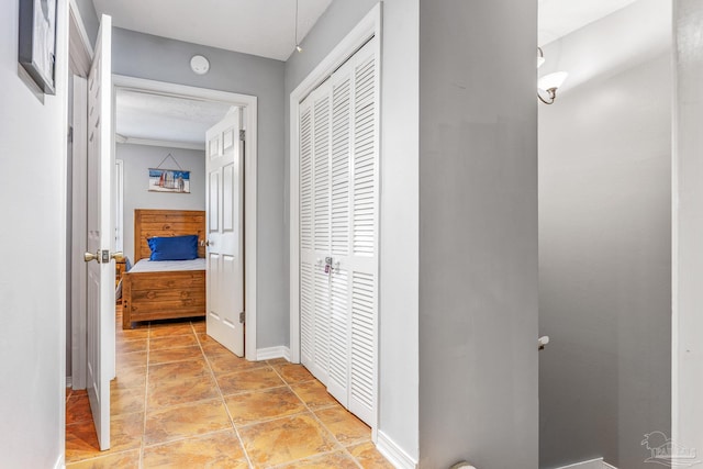 corridor featuring light tile patterned floors