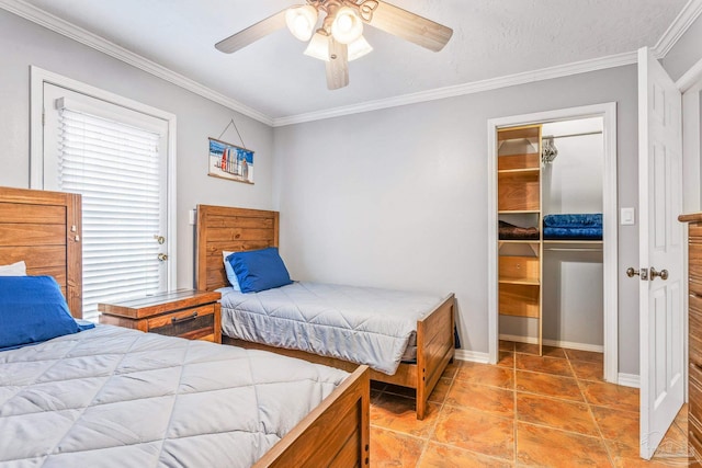 tiled bedroom with ceiling fan, a closet, and crown molding