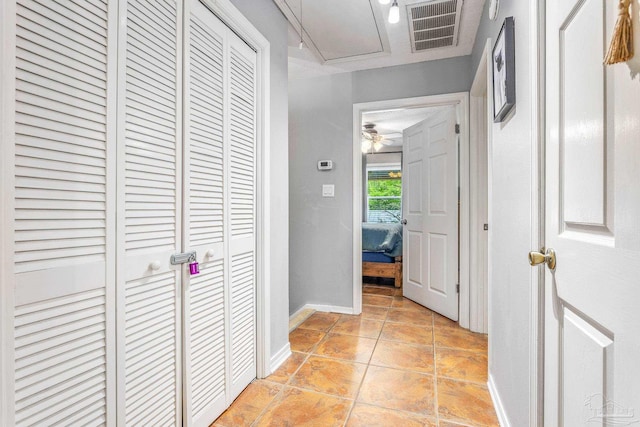 corridor featuring light tile patterned flooring