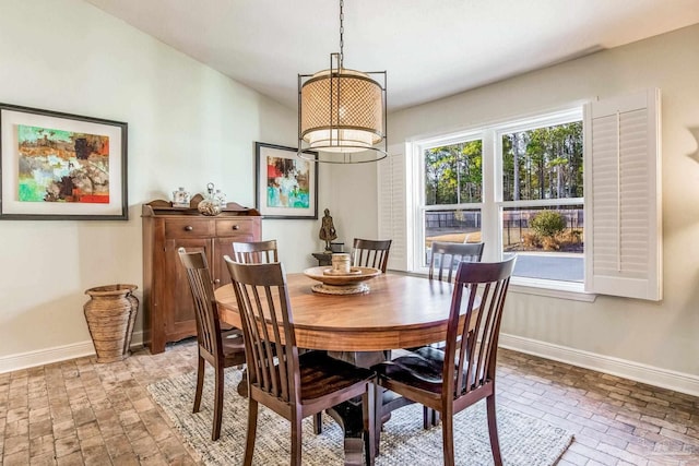 dining area featuring an inviting chandelier