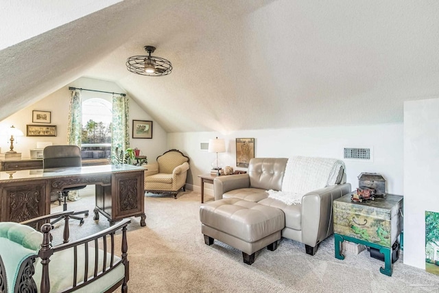 office space featuring vaulted ceiling, light carpet, and a textured ceiling