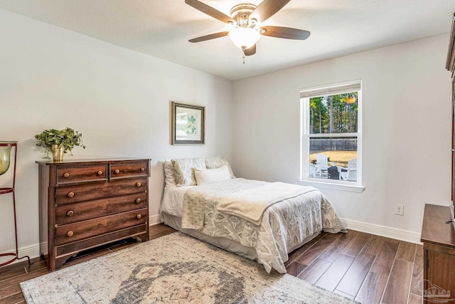 bedroom featuring ceiling fan and dark hardwood / wood-style flooring