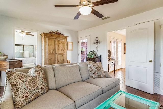 living room with hardwood / wood-style flooring and ceiling fan