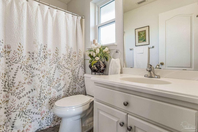 bathroom with vanity and toilet