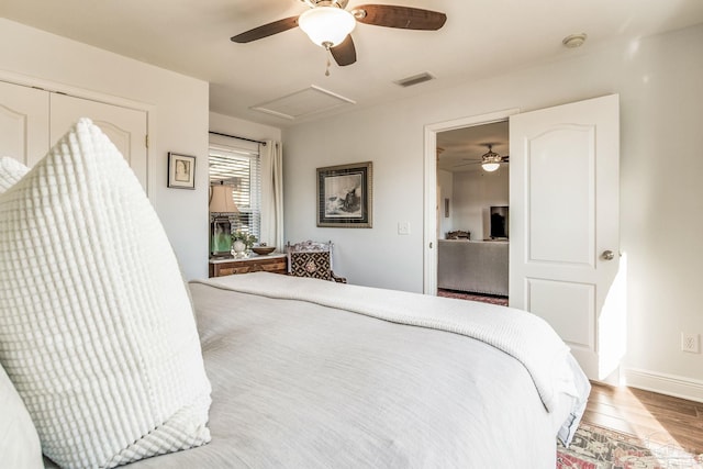 bedroom with light hardwood / wood-style floors and ceiling fan