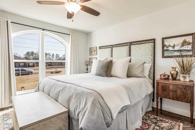 bedroom with hardwood / wood-style flooring and ceiling fan