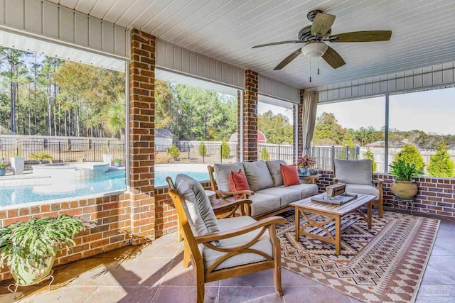 sunroom / solarium with ceiling fan